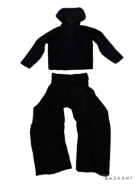 a black hoodie and pants are shown on a black background